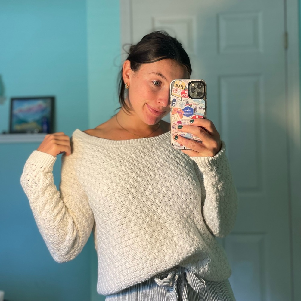 White, flattering sweater.